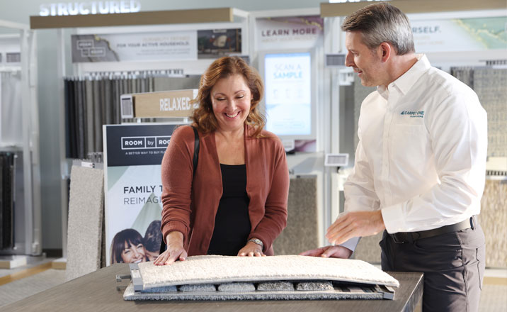 Women looking at carpet samples