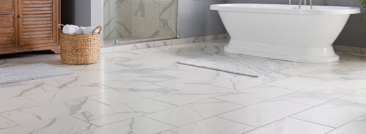 white tile flooring in bathroom with tub and shower